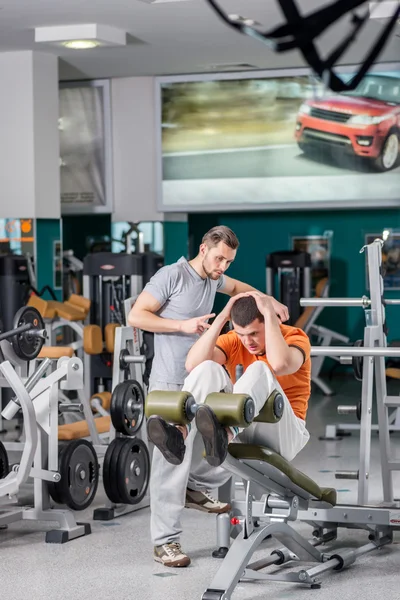 Two young men in sport club