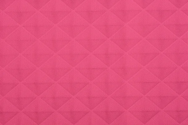 Pink fabric with geometric patterns, a background