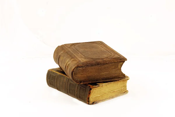 Two old books on a white background