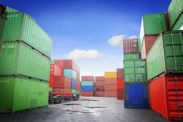 Stacked cargo containers in storage area of freight sea port terminal