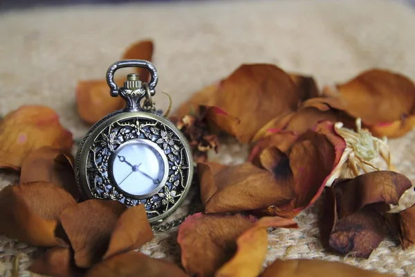 Vintage pocket watch with dry roose
