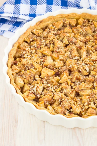 Delicious fresh baked apple pie on a wooden surface