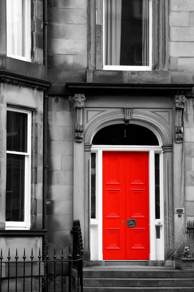 Red door in black and white in Edinburgh
