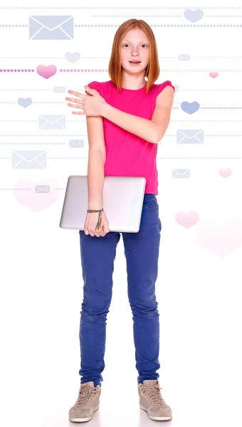 Red-haired girl with laptop on the background with hearts and letters