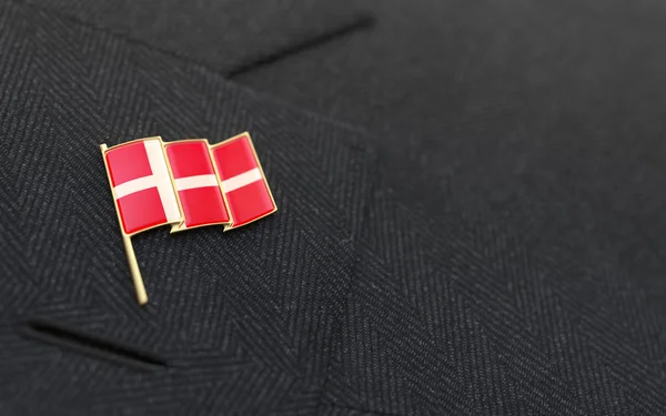 Denmark flag lapel pin on the collar of a business suit