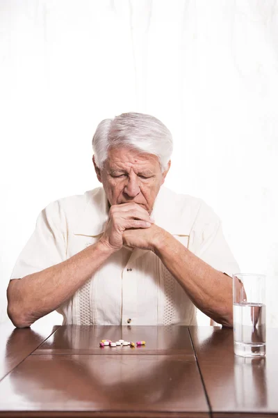 Elderly man with medication