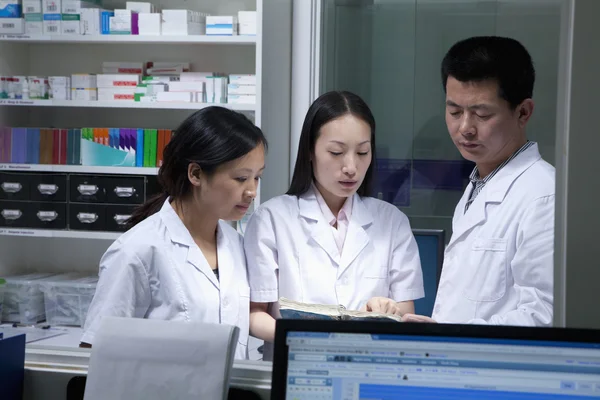 Veterinarias going through paperwork