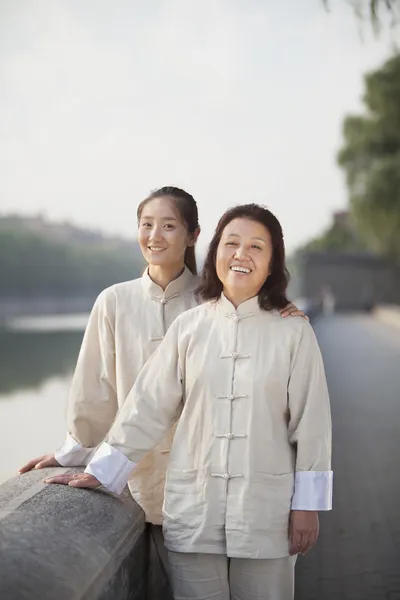 Chinese Women With Tai Ji Clothes Smiling At Camera