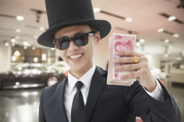 Rich Man Showing Off His Money