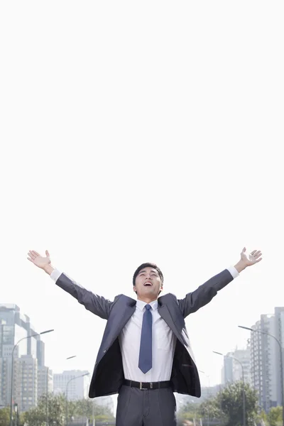 Businessman with Arms Raised