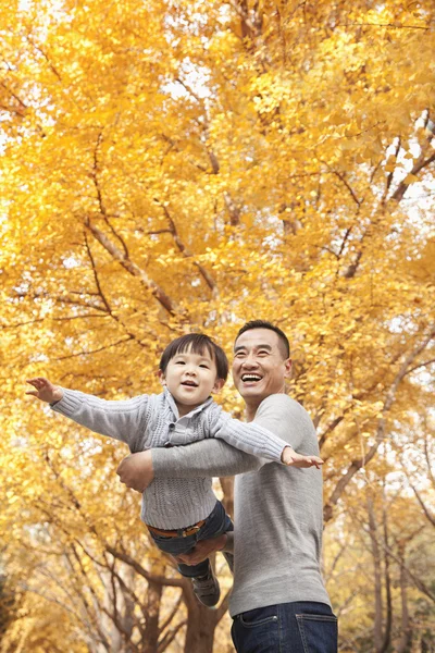 Father and Son Playing at Park