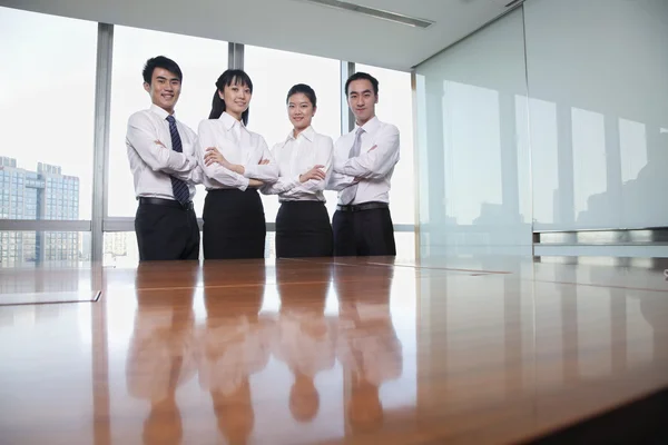 Business people standing by conference table