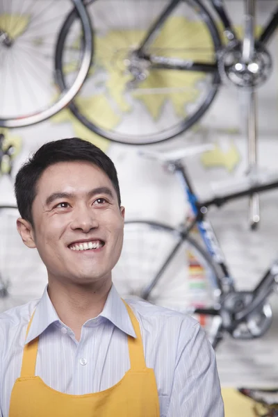 Male mechanic in bicycle store