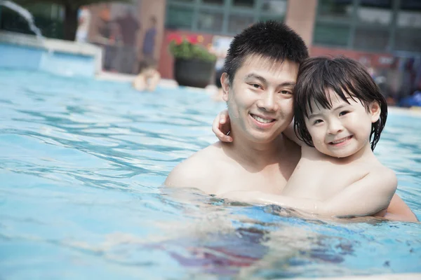 Father and son in the pool on vacation