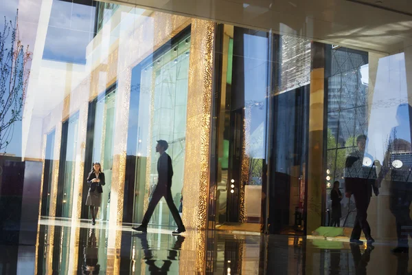Business People walking through the lobby of an office building