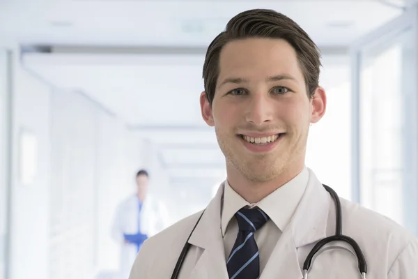 Doctor in lab coat in the hospital