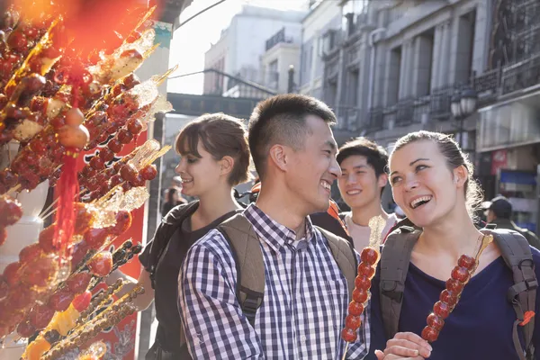 People buying candied haw