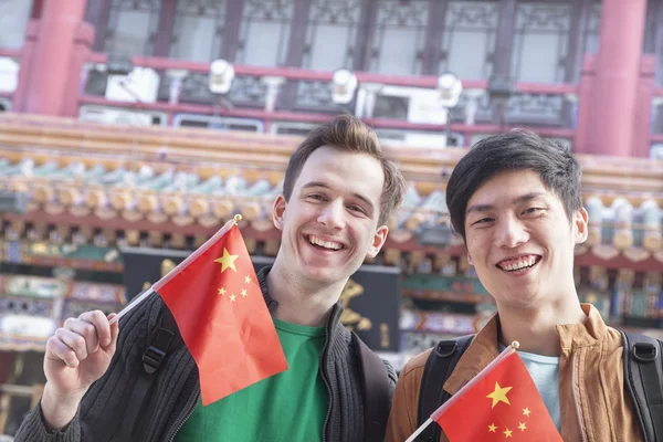 Men holding Chinese flags