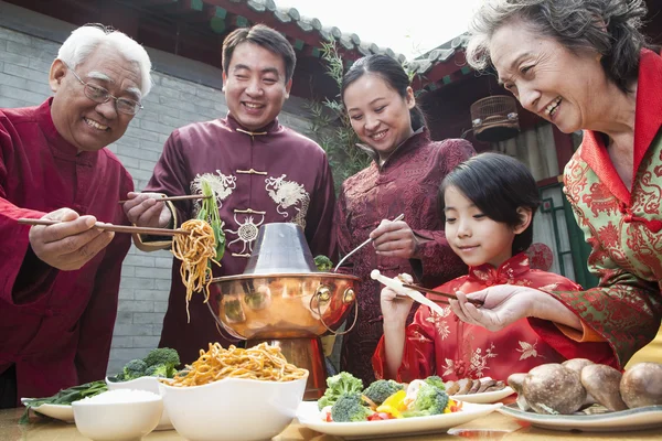 Family enjoying Chinese meal