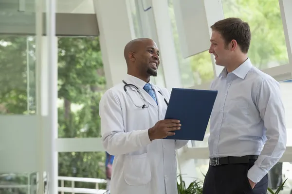 Doctor and patient discussing medical record