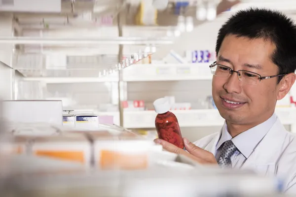 Pharmacist examining prescription medication