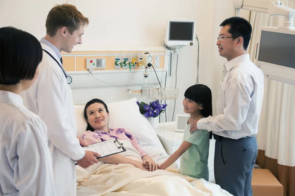 Family visiting the mother in the hospital