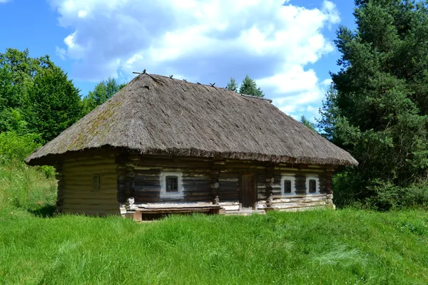 Old traditional Ukrainian house hata made from wood and straw
