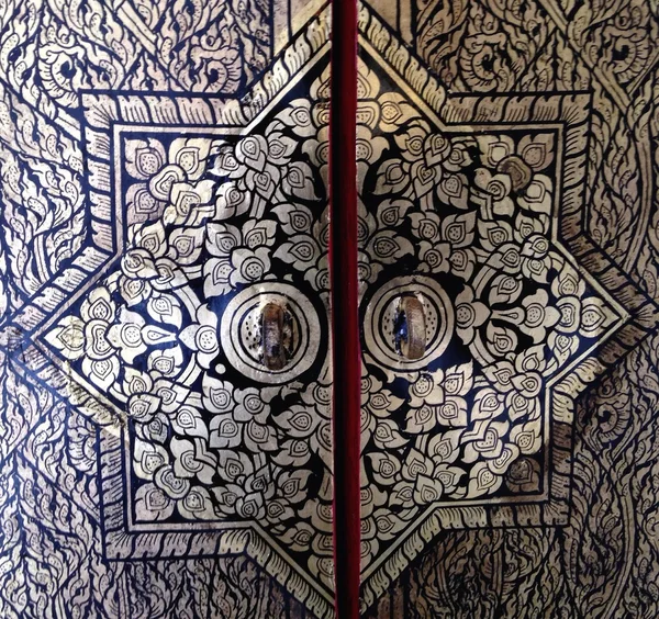 Door panel and bolt in temple. Bangkok Thailand