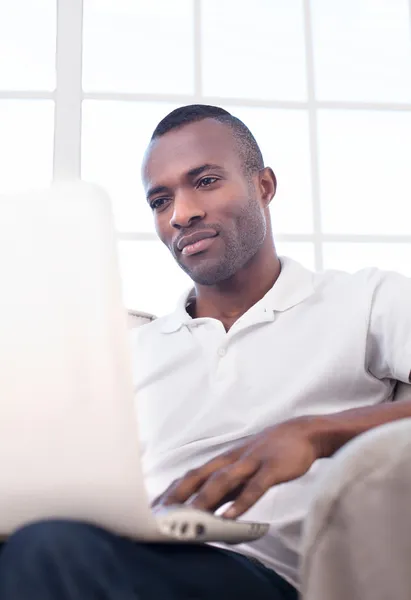 Young African man using computer