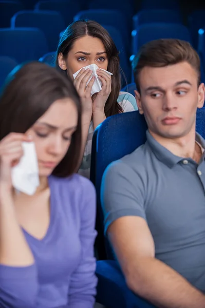 Bored young man with crying women