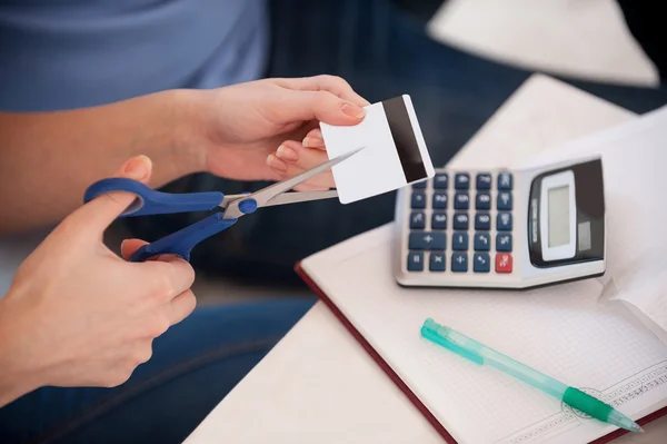 Woman cutting a credit