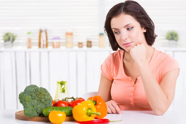 Woman looking at the vegetables