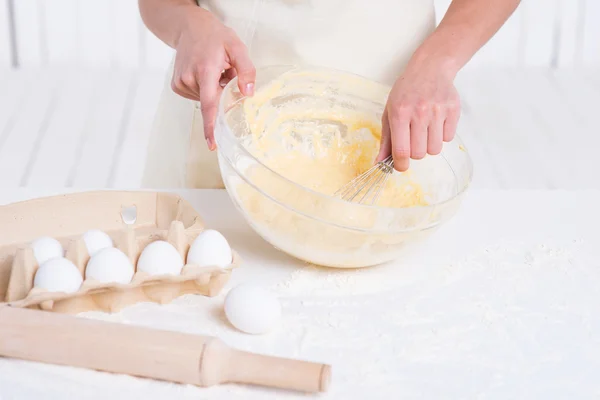 Woman mixing dough