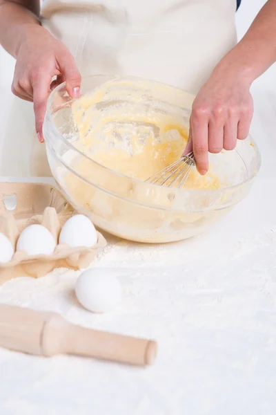 Woman mixing dough