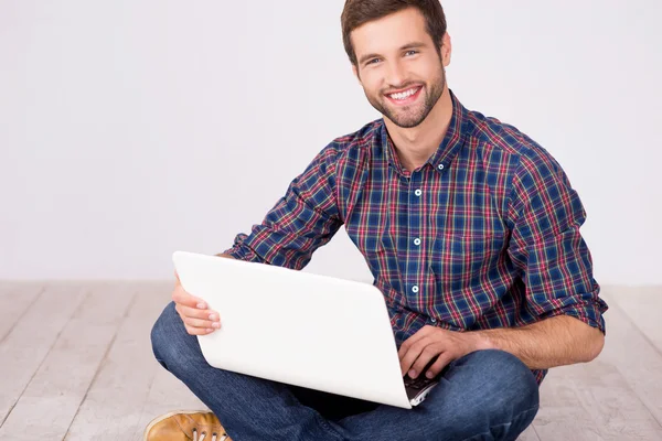 Handsome man with laptop.