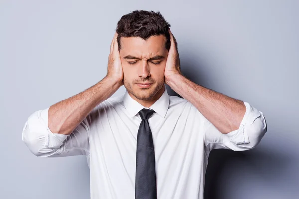 Frustrated young man in shirt and tie