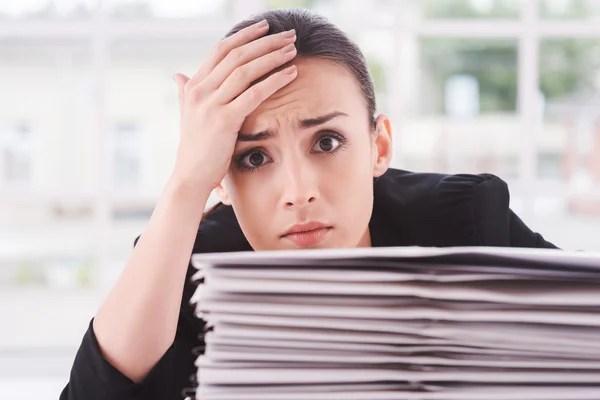 Tired and overworked woman in suit