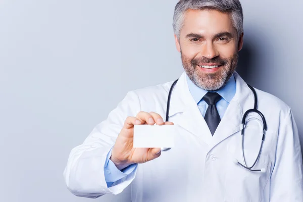 Doctor holding business card.