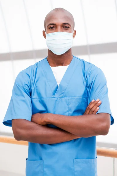 African doctor in surgical mask