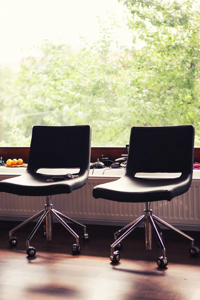 Black leather chairs in office