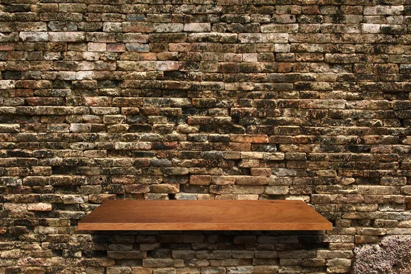 Wood shelf on brick wall