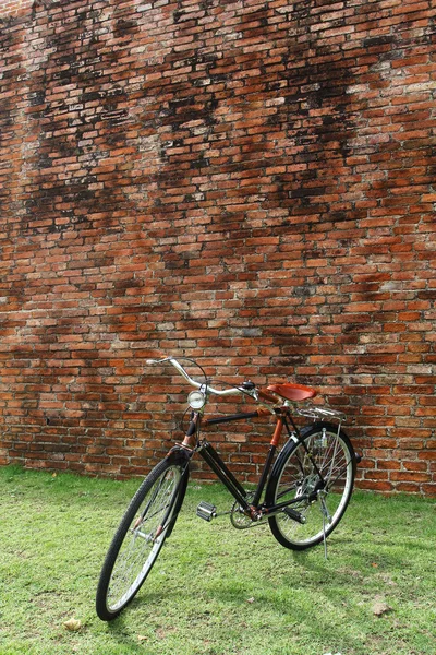 Vintage bicycle and brick wall