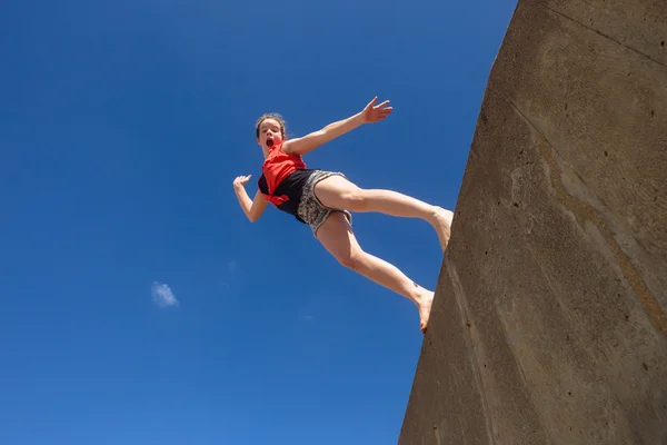 Teen Girl Jumping Blue Sky Parkour