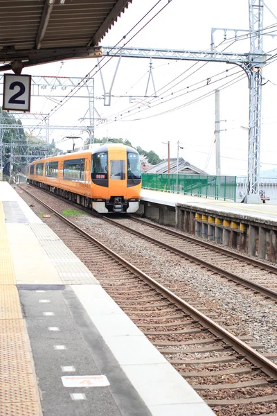 Local train is passing Hasedera station at Nara city in Japan