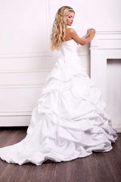Beautiful bride with blond hair in wedding dress