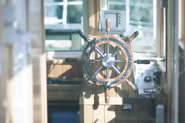 Wood steering wheel in a ship