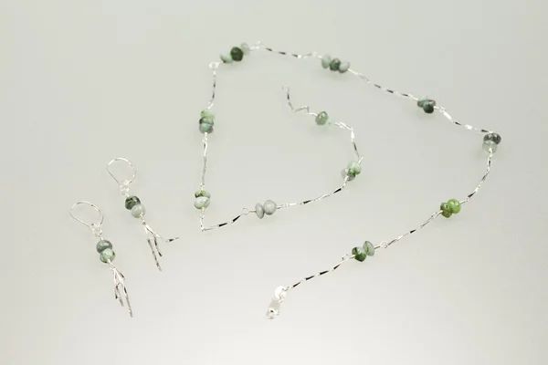 Silver earrings and necklace with emerald gemstones