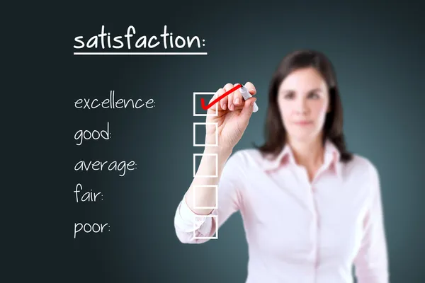 Young business woman checking excellence on customer satisfaction survey form.