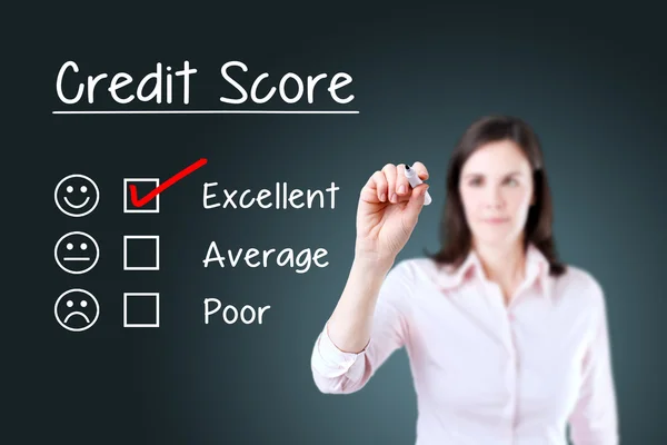 Hand putting check mark with red marker on excellent credit score evaluation form. Blue background.