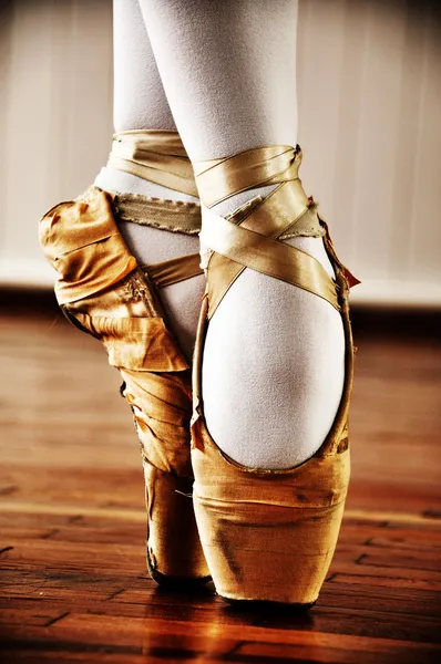 Ballet dancer with old shoes